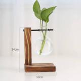 مزهرية زجاجية معلقة بقاعدة خشبية Glass Hanging Vase with Wooden Stand مزهرية زجاجية معلقة بقاعدة خشبية Glass Hanging Vase with Wooden Stand